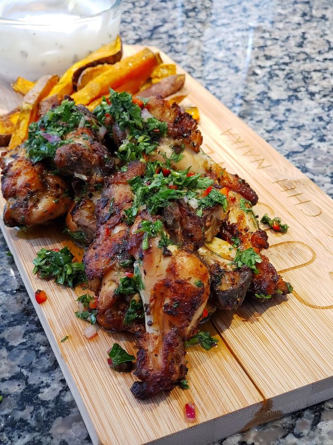 Chicken wings with chimichurri and garlic sauce